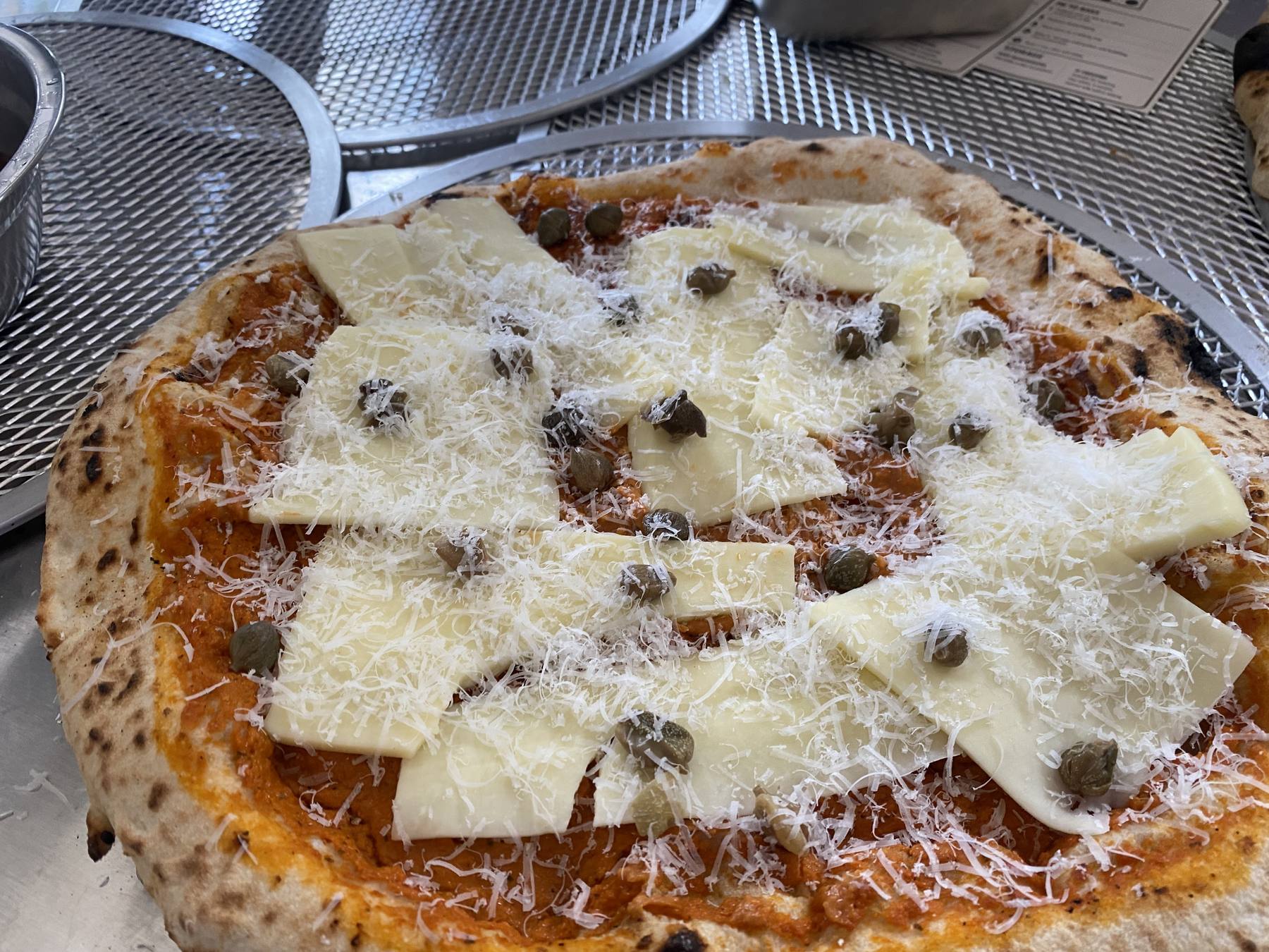 Home Slice pizza with cheese and capers